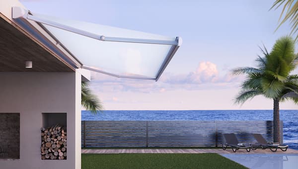 base plus folding arm awning on coastal home